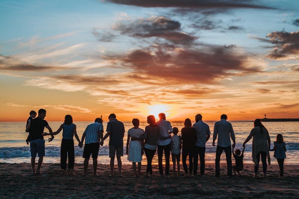 large family on beach