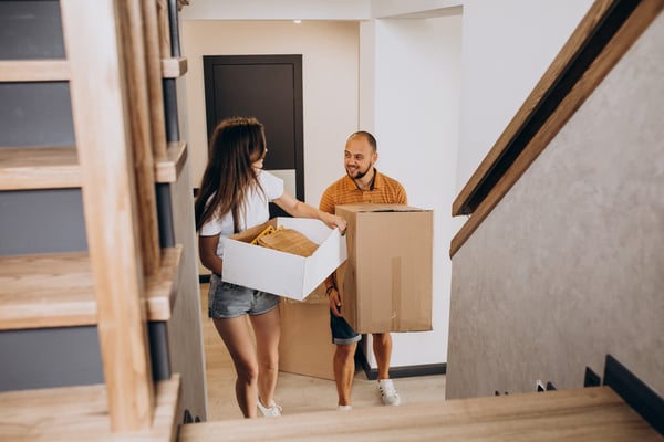 young-family-moving-into-their-new-house (1)